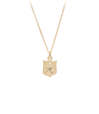 Charm Necklaces 14K Gold Diamond Engraved Enamel Initial Baby Shield Necklace for One of a Kind Engagement Rings designed by Sofia Kaman handmade in Los Angeles