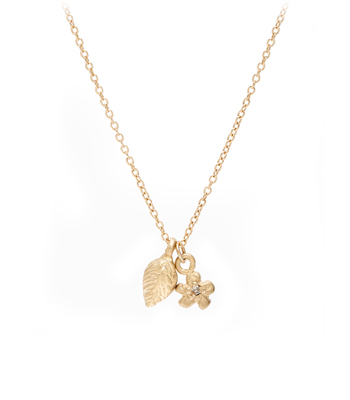 14K Gold and Diamond Leaf and Daisy Flower Charm Necklace designed by Sofia Kaman handmade in Los Angeles