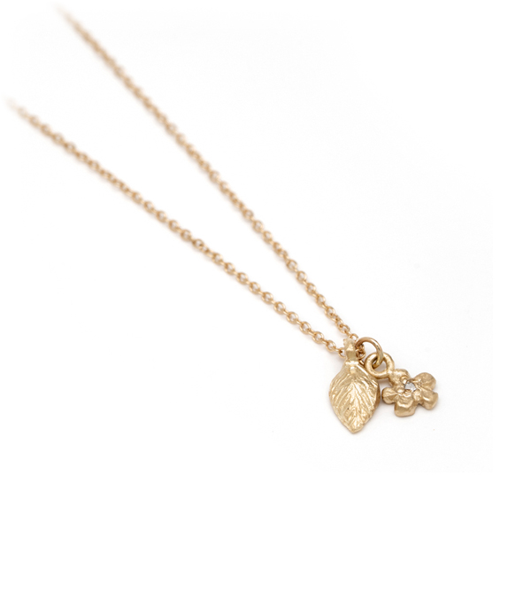 Gold Leaf And Flower Charm Necklace
