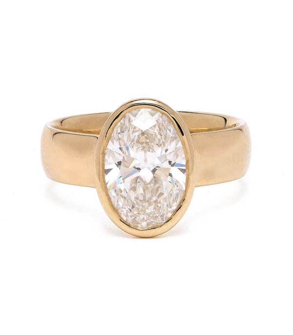 14K Shiny Yellow Gold Oval Bezel Lab Grown Diamond Engagement Rings For Women designed by Sofia Kaman handmade in Los Angeles using our SKFJ ethical jewelry process.