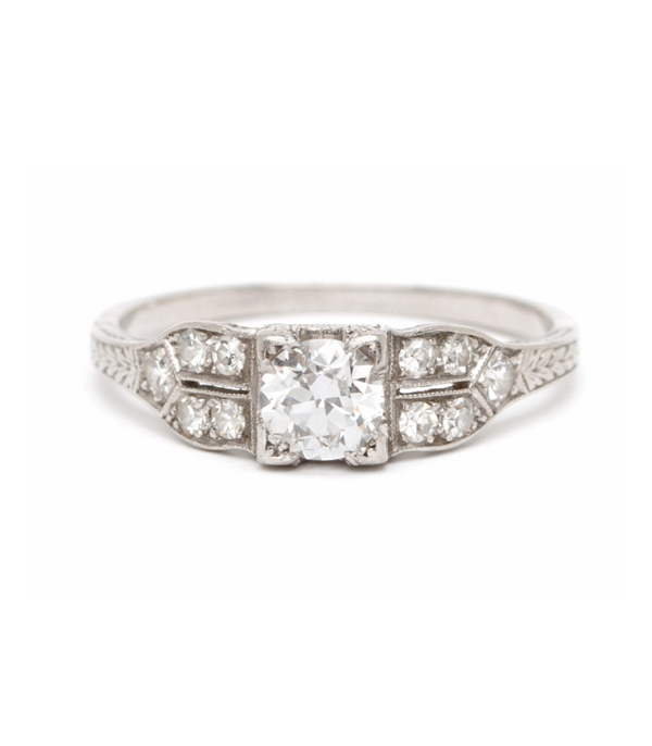 This sparkling vintage Art Deco engagement ring with Old European cut diamond is ideal for the sophisticated lady who appreciates intricate details and timeless elegance. This captivating 1930’s beauty features a 0.40 ct center Old European cut diamond with accents of single cut diamonds, and delicate engraving along the shoulders of the band. Artful filigree work in the gallery completes thisvintage Art Deco engagement ring.Size 7** SOLD ** curated by Sofia Kaman.  This piece has been sold and is in Vintage Archive.